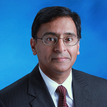 professional headshot of Naseer Irfan Syed